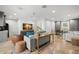 Open living room featuring stone tile flooring, modern furniture and ceiling fan at 3412 W Mckay Ave, Tampa, FL 33609