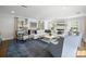 Bright and spacious living room with large sectional sofa, fireplace, and natural light at 3412 W Mckay Ave, Tampa, FL 33609