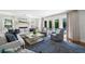 Elegant living room featuring a fireplace, comfortable seating, and access to the pool area at 3412 W Mckay Ave, Tampa, FL 33609