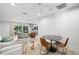 Open living room features travertine floors, neutral colors, and an additional seating area at 3412 W Mckay Ave, Tampa, FL 33609