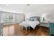 Spacious main bedroom with hardwood floors, natural light, and elegant decor at 3412 W Mckay Ave, Tampa, FL 33609