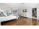 Bright main bedroom features hardwood floors, walk-in closet, and neutral décor at 3412 W Mckay Ave, Tampa, FL 33609