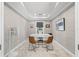 Modern home office featuring a neutral color palette, minimalist decor, and ample natural light at 3412 W Mckay Ave, Tampa, FL 33609