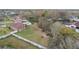 Areal view of a home featuring a spacious backyard with a white fence and mature trees at 3613 Pendleton Way, Land O Lakes, FL 34639