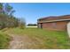Home's backyard features a well-maintained lawn, and a partial white fence at 3613 Pendleton Way, Land O Lakes, FL 34639