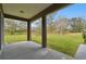 Enjoy the view of this home's landscaped backyard from the shade and comfort of the covered patio at 3613 Pendleton Way, Land O Lakes, FL 34639