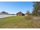 Spacious backyard enclosed by a white fence, offering privacy and ample space for recreation at 3613 Pendleton Way, Land O Lakes, FL 34639