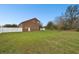 View of the home's exterior and large backyard, showcasing the outdoor space at 3613 Pendleton Way, Land O Lakes, FL 34639
