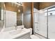 The bathroom features a white vanity and a shower with sliding glass doors at 3613 Pendleton Way, Land O Lakes, FL 34639