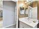 This is a bright bathroom with a white vanity and sink, with a large mirror above at 3613 Pendleton Way, Land O Lakes, FL 34639