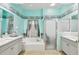 Bathroom featuring a tub and shower combination, custom tile and vanity with white cabinetry at 3613 Pendleton Way, Land O Lakes, FL 34639