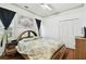 Well lit bedroom featuring a fan wall decor and a window with natural light at 3613 Pendleton Way, Land O Lakes, FL 34639