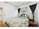 Comfortable bedroom featuring a queen size bed, decorative walls, and natural lighting at 3613 Pendleton Way, Land O Lakes, FL 34639