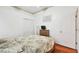 Comfortable bedroom featuring a full-size bed, closet, TV, and natural lighting at 3613 Pendleton Way, Land O Lakes, FL 34639