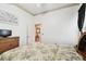 A cozy bedroom with a television, dresser, and doorway leading to other rooms at 3613 Pendleton Way, Land O Lakes, FL 34639
