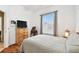 Inviting bedroom with a dresser, window letting in natural light, and comfortable decor at 3613 Pendleton Way, Land O Lakes, FL 34639
