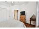 Bright bedroom with a dresser and a door leading to another room at 3613 Pendleton Way, Land O Lakes, FL 34639