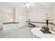 Spacious bonus room features exercise equipment, vaulted ceilings, and a ceiling fan at 3613 Pendleton Way, Land O Lakes, FL 34639