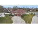 Charming home featuring a well-manicured lawn, a two-car garage, and lush landscaping at 3613 Pendleton Way, Land O Lakes, FL 34639