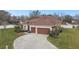 Beautiful home with a well-maintained lawn, two-car garage and lovely landscaping at 3613 Pendleton Way, Land O Lakes, FL 34639