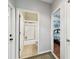 Hallway with doors to a bathroom with shower and a bedroom with a large window at 3613 Pendleton Way, Land O Lakes, FL 34639
