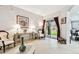 Bright living room featuring tile floors, sliding glass door to backyard at 3613 Pendleton Way, Land O Lakes, FL 34639