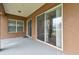 Covered outdoor patio with sliding glass doors leading into the house at 3613 Pendleton Way, Land O Lakes, FL 34639