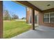 Covered patio overlooking a spacious backyard with a view of the fenced yard at 3613 Pendleton Way, Land O Lakes, FL 34639