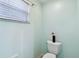 This is a bright powder room with light blue walls and a window at 3613 Pendleton Way, Land O Lakes, FL 34639