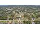 Expansive aerial view of a peaceful residential neighborhood featuring lush greenery and serene lakes at 3655 Candia Ave, North Port, FL 34286