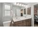 Bathroom featuring double sinks with quartz countertops and modern vanity at 3655 Candia Ave, North Port, FL 34286