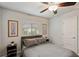Comfortable bedroom with neutral decor, a window letting in natural light, and neutral wall art at 3655 Candia Ave, North Port, FL 34286