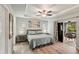 Inviting main bedroom with a king bed, tray ceiling, and sliding glass doors to the lanai at 3655 Candia Ave, North Port, FL 34286