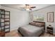 Cozy bedroom with a comfortable bed, neutral decor, and light wood-look flooring at 3655 Candia Ave, North Port, FL 34286