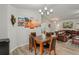Inviting dining area with a wood table, comfortable chairs, and modern accents at 3655 Candia Ave, North Port, FL 34286