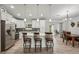 Bright kitchen with white cabinetry, a center island with seating, and stainless steel appliances at 3655 Candia Ave, North Port, FL 34286