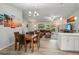 Open-concept living room flowing into the dining area and featuring stylish decor and ample space at 3655 Candia Ave, North Port, FL 34286