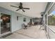 Large screened in patio with ceiling fan, ample seating and grilling area at 3655 Candia Ave, North Port, FL 34286