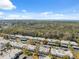 Aerial view of a residential community near a wooded area and waterfront, showcasing lush landscapes at 4222 Richmere Dr # 4222, New Port Richey, FL 34652