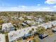 Aerial view of a residential community with mature trees, carports, and well-maintained landscaping at 4222 Richmere Dr # 4222, New Port Richey, FL 34652