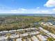An aerial view of the community showing proximity to scenic marshlands, bay waters, and the beautiful blue sky at 4222 Richmere Dr # 4222, New Port Richey, FL 34652