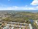 An aerial view of the community showing proximity to scenic marshlands, bay waters, and the beautiful blue sky at 4222 Richmere Dr # 4222, New Port Richey, FL 34652
