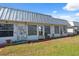 Back of home featuring multiple sliding glass doors to access backyard at 4222 Richmere Dr # 4222, New Port Richey, FL 34652