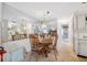 Cozy dining area complemented by a mirrored wall and open to the adjacent kitchen at 4222 Richmere Dr # 4222, New Port Richey, FL 34652