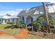 Lovely villa featuring well-manicured landscaping and blue trim at 4222 Richmere Dr # 4222, New Port Richey, FL 34652