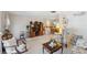 Bright living room featuring comfortable seating, entertainment center, and easy access to dining area at 4222 Richmere Dr # 4222, New Port Richey, FL 34652