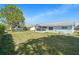 Spacious backyard featuring a screened-in lanai and ample green space for outdoor enjoyment at 4662 Dewey Dr, New Port Richey, FL 34652