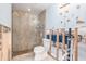 Stylish bathroom featuring a glass shower with brown tile and modern fixtures at 4662 Dewey Dr, New Port Richey, FL 34652