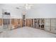 Bedroom undergoing renovation, revealing the wall studs and an open doorway at 4662 Dewey Dr, New Port Richey, FL 34652