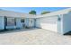 A one story home featuring a wide paved driveway and a one car garage at 4662 Dewey Dr, New Port Richey, FL 34652